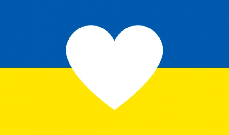 Blue and yellow split background with white heart graphic centered in the middle
