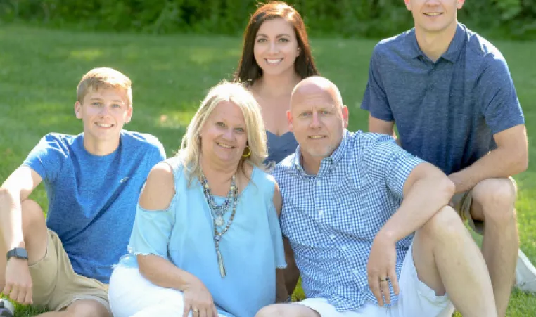 Holly Butenhoff and family portrait pose